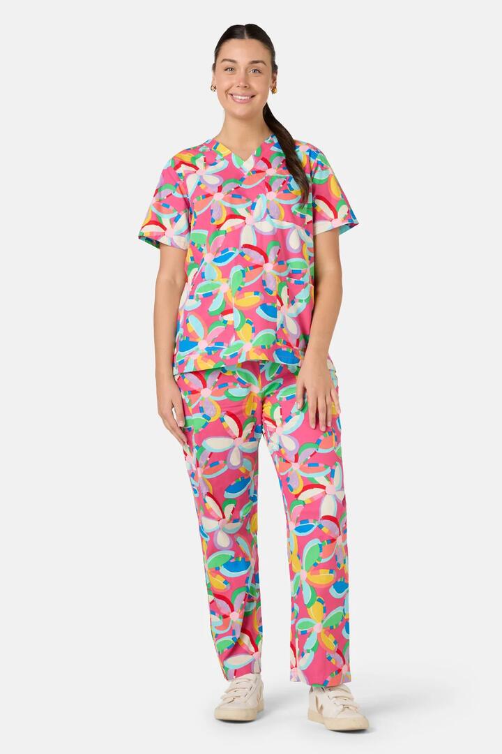 Image of a model wearing Uniforms & Workwear. Product name - Rainbow Daisy Scrub Set in Multi colour by brand - Gorman