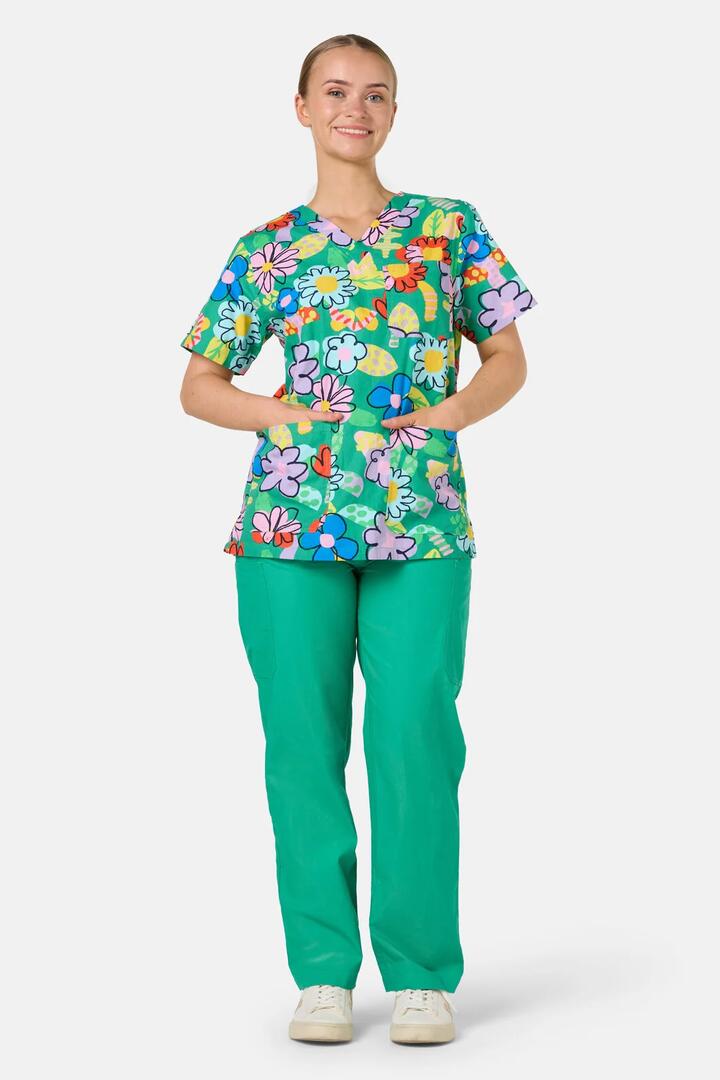 Image of a model wearing Uniforms & Workwear. Product name - Floral Pop Mixed Scrub Set in Green colour by brand - Gorman