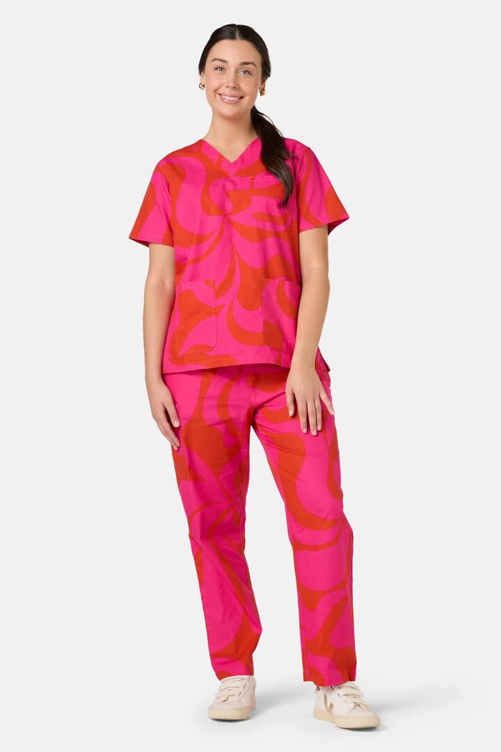 Image of a model wearing Uniforms & Workwear. Product name - Wavelength Scrub Set in Pink colour by brand - Gorman