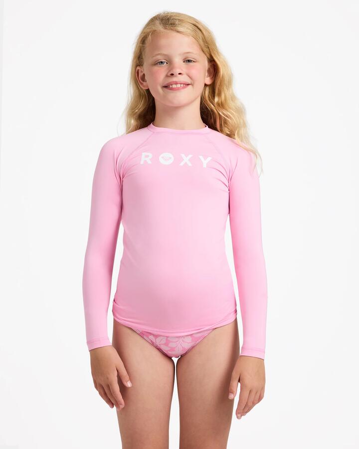 Image of a model wearing Tops. Product name - Roxy Girls 8-16 Essential Upf 50 Long Sleeve Rashguard M Pink in M Pink colour by brand - Roxy