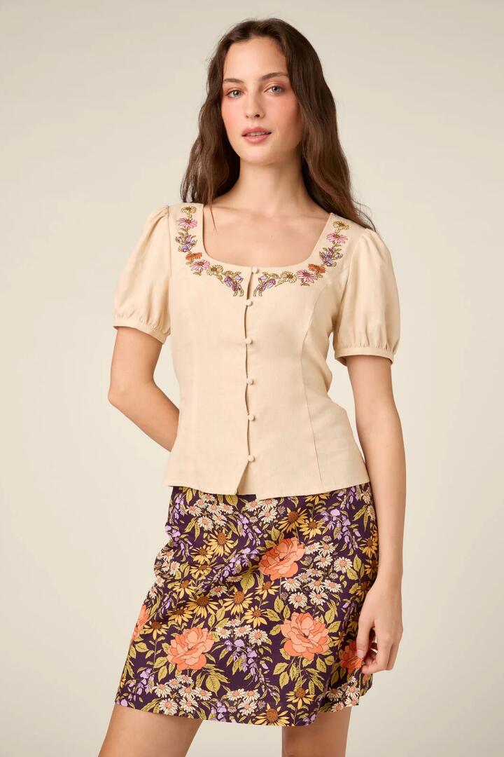 Image of a model wearing Tops. Product name - Addie Floral Embroidered Top in Cream colour by brand - Princess Highway