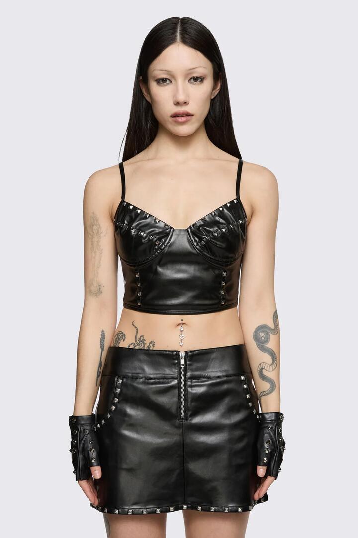 Image of a model wearing Tops. Product name - Cindy Corset Top in Black colour by brand - Dangerfield