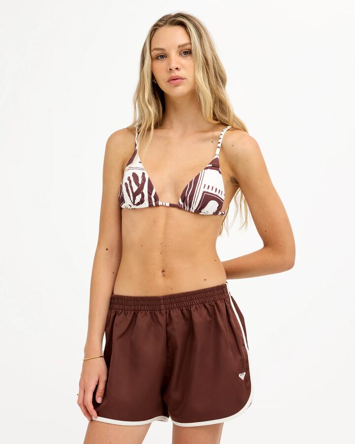 Image of a model wearing Shorts. Product name - Roxy Womens Racer Elastic Waist Shorts Java in Java colour by brand - Roxy