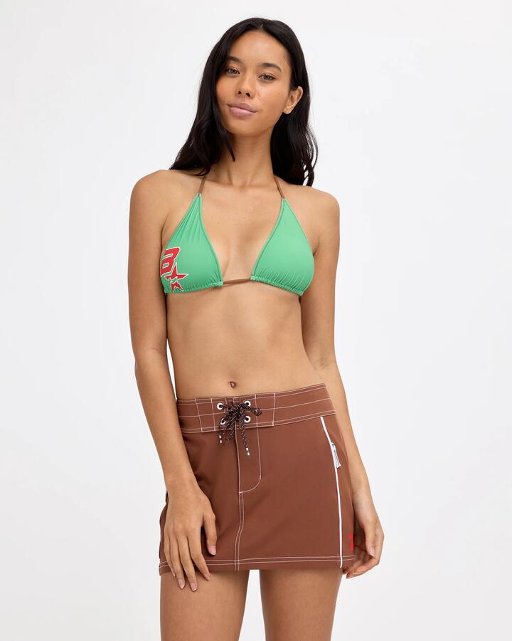 Image of a model wearing Skirts. Product name - Billabong Womens Nu Wave Boardie Mini Skirt Dark Choc in Dark Choc colour by brand - Billabong
