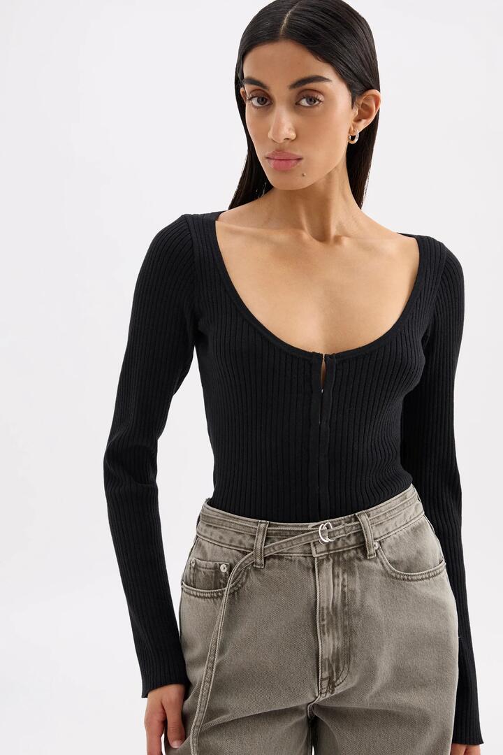 Image of a model wearing Outerwear. Product name - Arlotte Black Soft Rib Cotton Blend Knit Cardigan in Black colour by brand - Nude Lucy