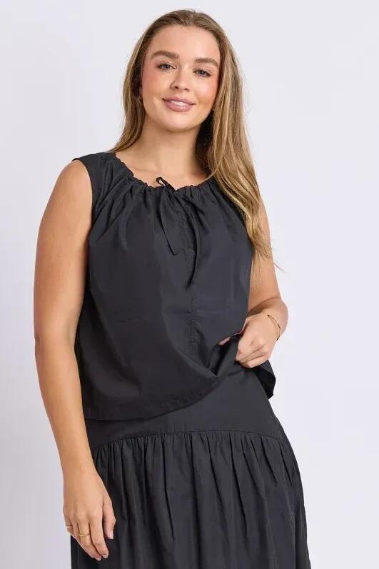 Image of a model wearing Tops. Product name - Winslet Black Collar Tie Sleeveless Top in Black colour by brand - Foxwood
