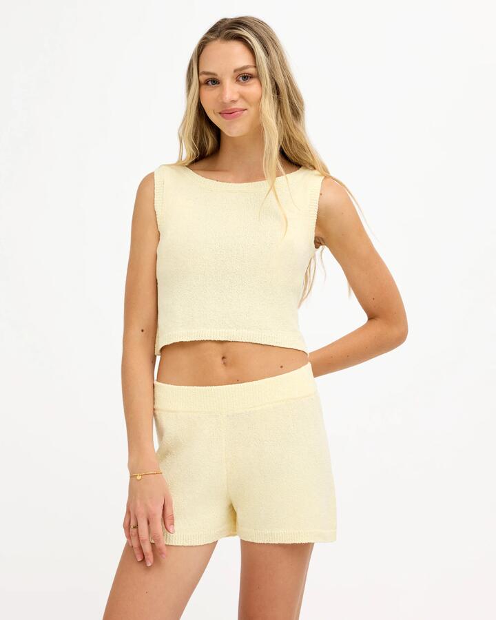 Image of a model wearing Tops. Product name - Roxy Womens Golden Tank Top Lemon Drop in Lemon Drop colour by brand - Roxy