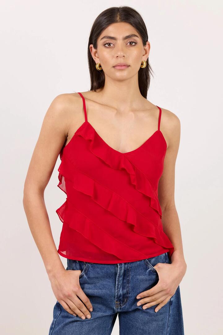 Image of a model wearing Tops. Product name - Outgoing Flame Georgette Frill Front Cami Top in Flame colour by brand - Georgia Zoe
