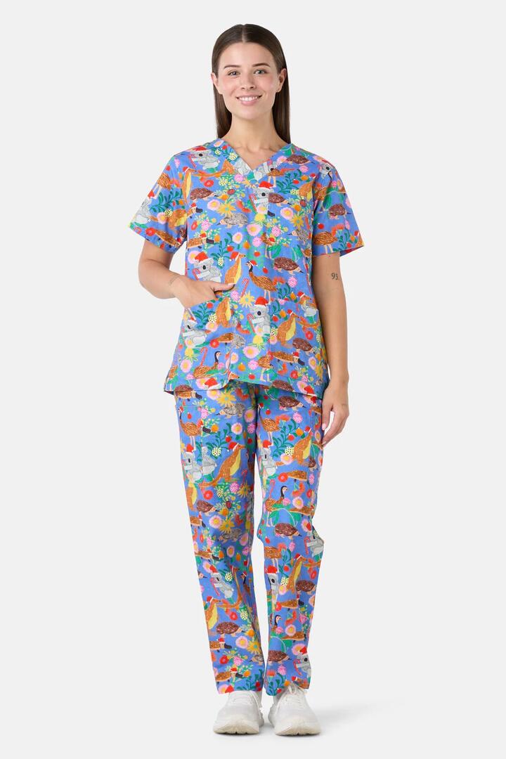 Image of a model wearing Uniforms & Workwear. Product name - Bush Christmas Scrub Set in Blue colour by brand - Scrubs With Love