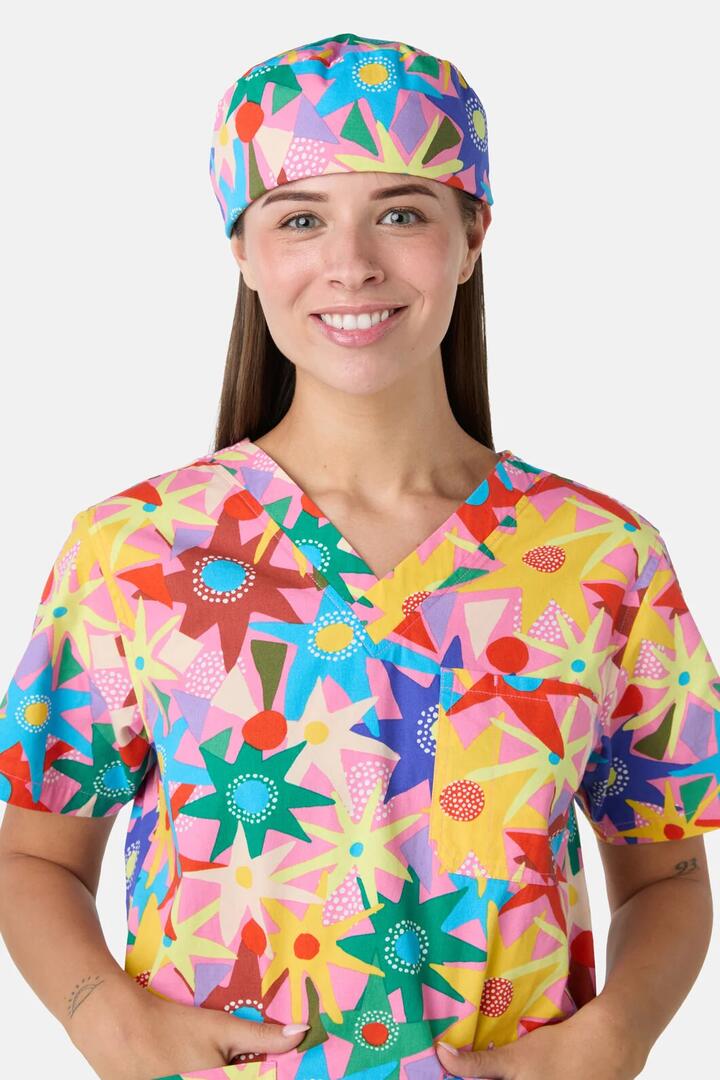 Image of a model wearing Uniforms & Workwear. Product name - Starlight Sorbet Scrub Hat in Pink colour by brand - Gorman
