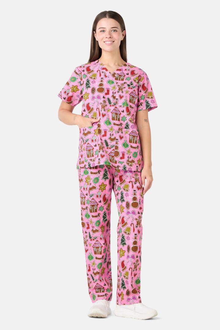 Image of a model wearing Uniforms & Workwear. Product name - Gingerbread Wonderland Scrub Set in Pink colour by brand - Gorman