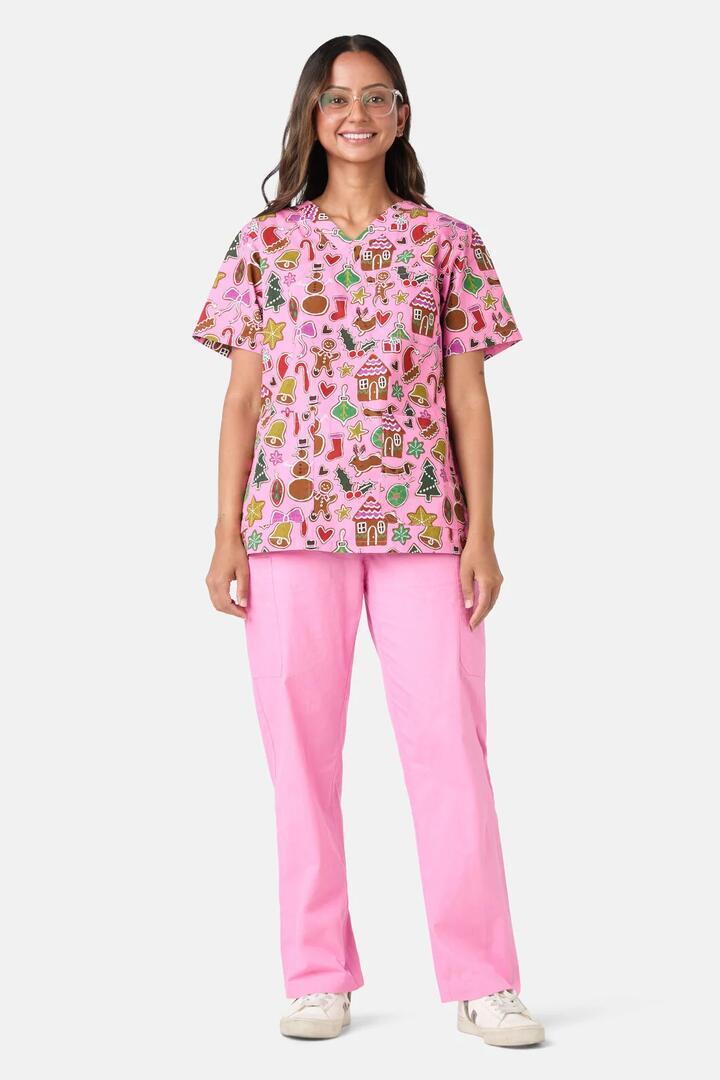 Image of a model wearing Uniforms & Workwear. Product name - Gingerbread Wonderland Mixed Scrub Set in Pink colour by brand - Gorman