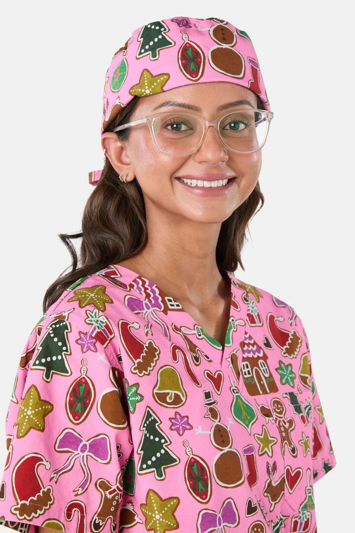 Image of a model wearing Uniforms & Workwear. Product name - Gingerbread Wonderland Scrub Hat in Pink colour by brand - Gorman
