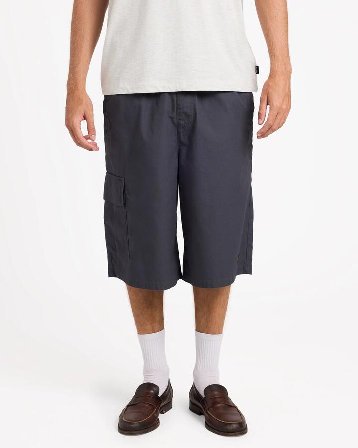 Image of a model wearing Shorts. Product name - RVCA Mens Dayshift Summit 23.5" Hybrid Shorts Garage Blue in Garage Blue colour by brand - RVCA