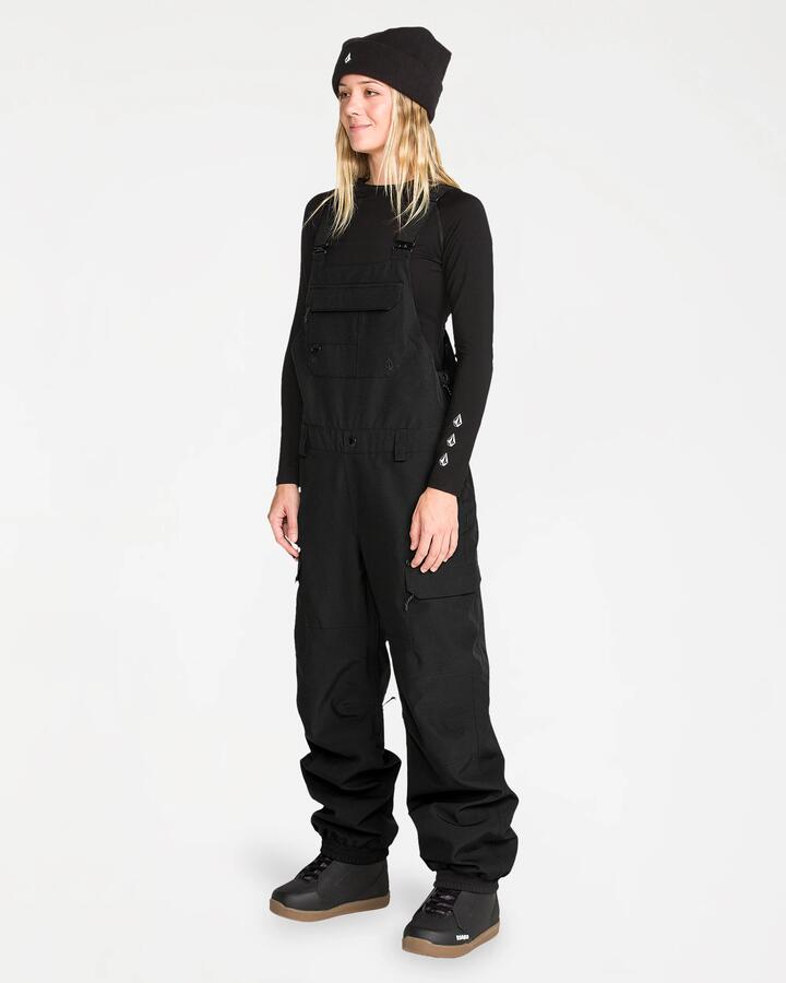 Image of a model wearing Pants. Product name - Volcom Womens Creston 3D Bib Pants Black in Black colour by brand - Volcom