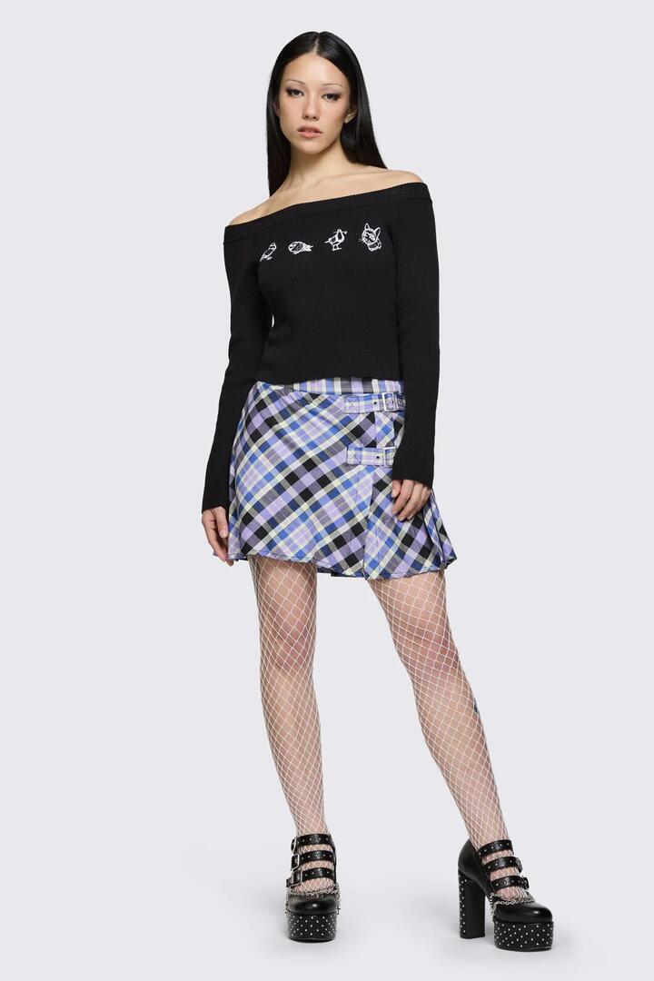 Image of a model wearing Skirts. Product name - Sketchy Tartan Strap Skort in Multi colour by brand - Dangerfield