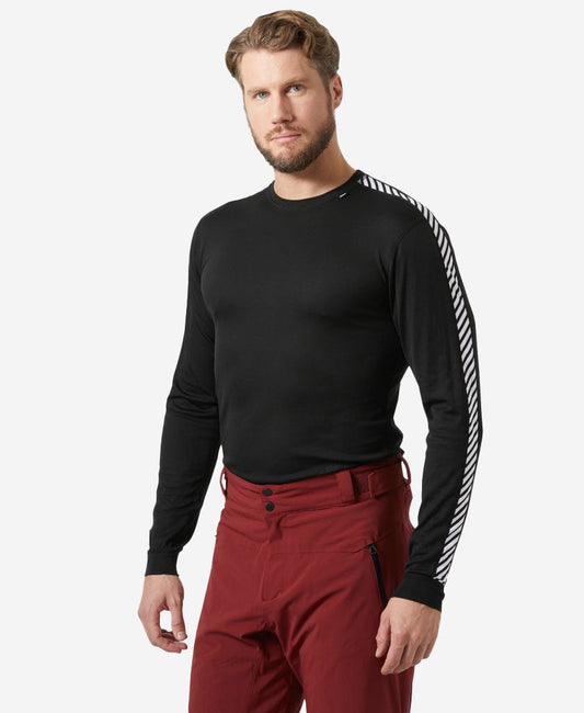 Image of a model wearing Tops. Product name - HH LIFA STRIPE CREW, Black in Black colour by brand - Helly Hansen