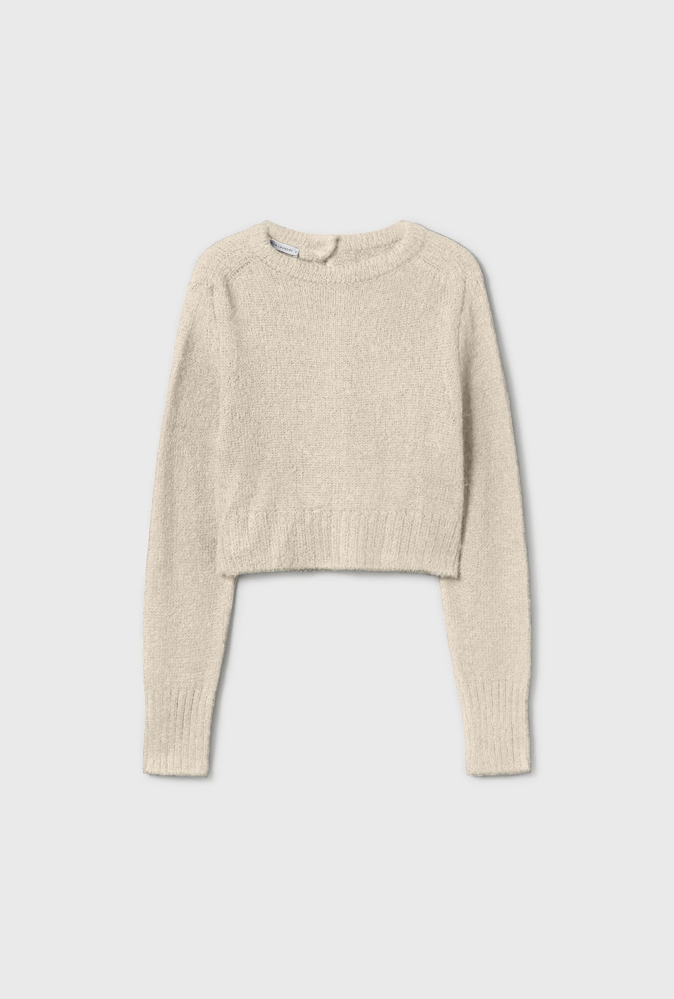 Image of a model wearing Outerwear. Productname: Silk Laundry Alpaca Reversed Cropped Cardigan Natural in Natural colour by brand - Silk Laundry