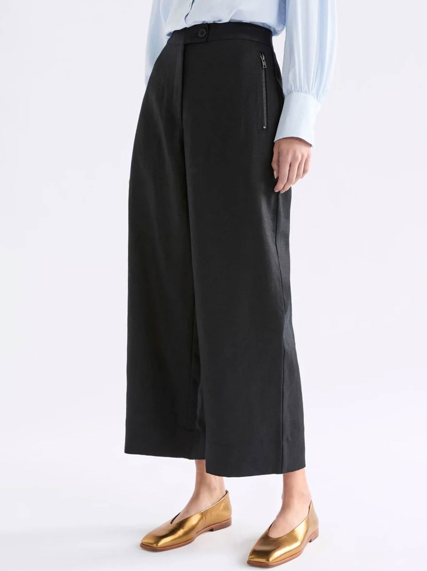 Image of a model wearing Pants. Product name - ELK ALTAIRS PANT in Burnt Chocolate colour by brand - Elk
