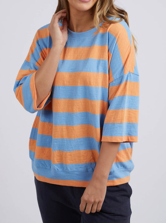 Image of a model wearing Tops. Product name - Elm Mazie Block Stripe Sweat in Azure Blue/Peach colour by brand - Elm