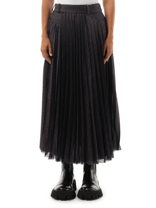 Image of a model wearing Denim. Productname: SACAI Denim Mix Pleat Skirt in Indigo colour by brand - SACAI