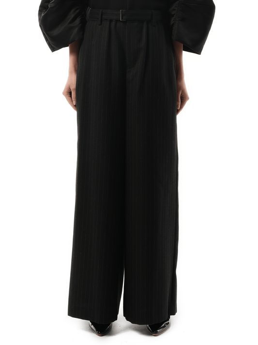 Image of a model wearing Pants. Productname: SACAI Chalk Stripe Pants in Black colour by brand - SACAI