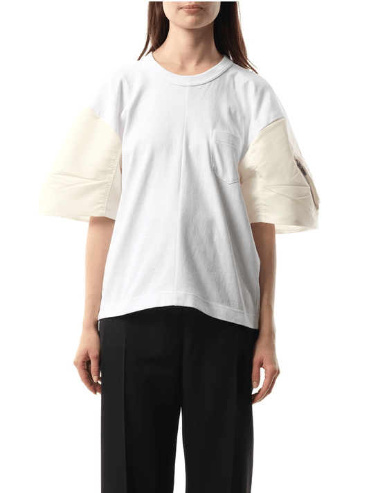 Image of a model wearing Tops. Productname: SACAI Nylon Twill Cotton Jersey T-Shirt in Off White colour by brand - SACAI