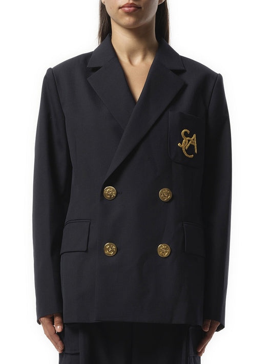 Image of a model wearing Outerwear. Productname: SACAI Emblem Suiting Jacket in Navy colour by brand - SACAI