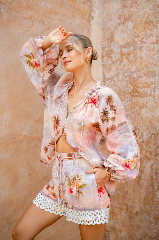Image of a model wearing Tops. Product name - Horizon Pink Tropical Blouse in Pink colour by brand - HEYCHIC