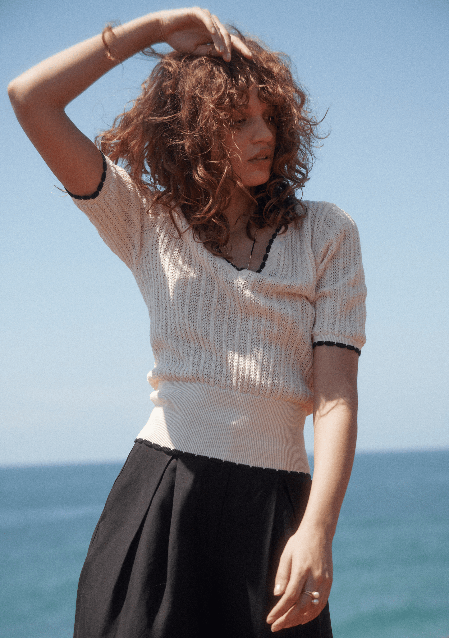 Image of a model wearing Outerwear. Productname: Auguste The Label Jude Knit Tee in Print colour by brand - Auguste The Label