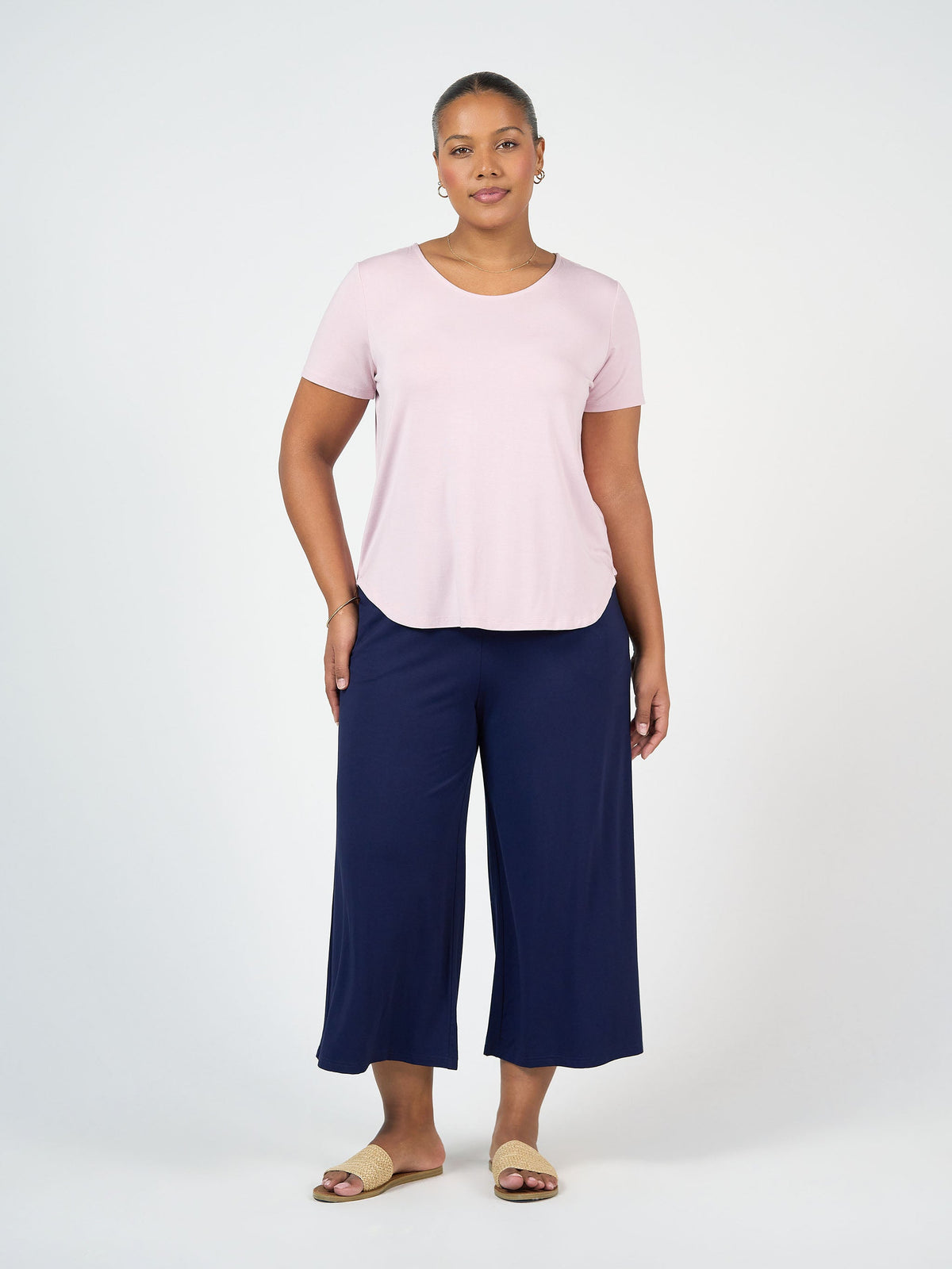 Image of a model wearing Pants. Product name - Ciara 7/8 Length Bamboo Culottes Navy in Navy colour by brand - Lou Lou