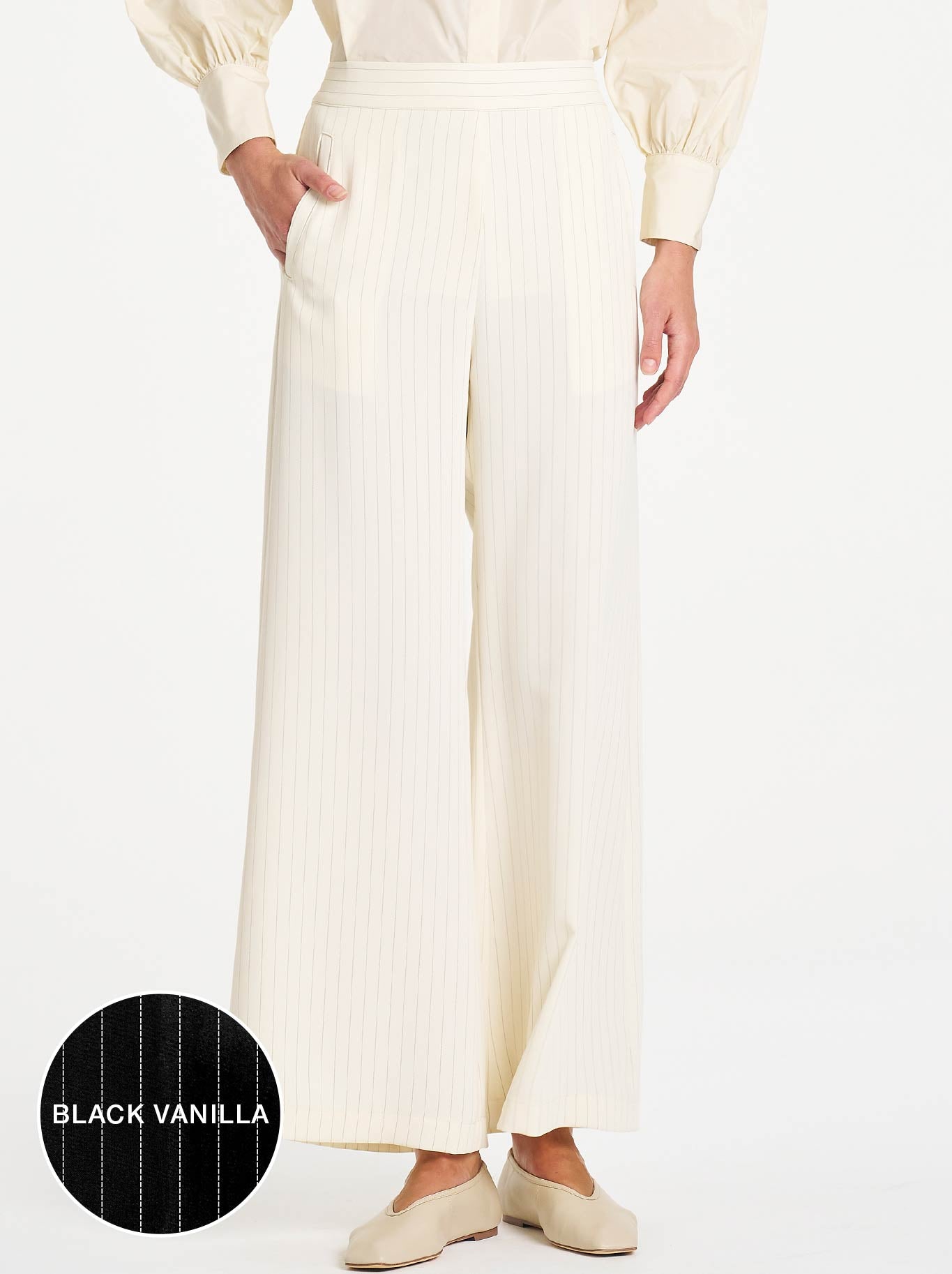 Image of a model wearing Pants. Product name - Mela Purdie Suit Pant in Black/Vanilla colour by brand - Mela Purdie