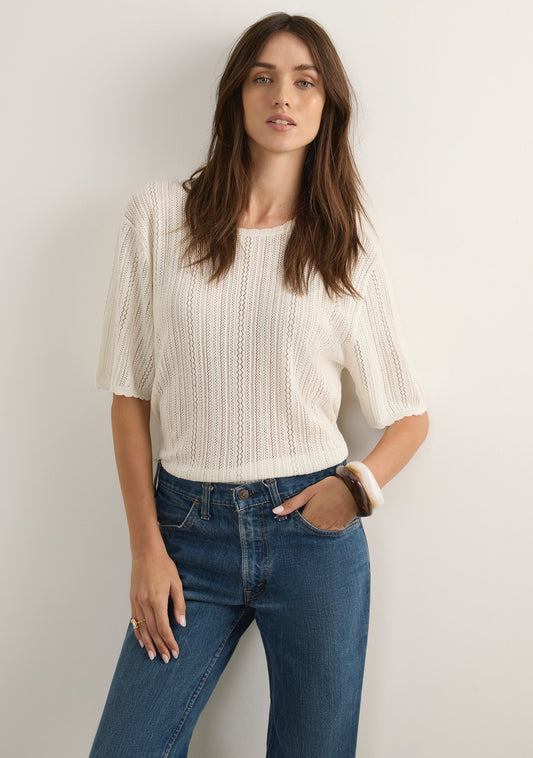 Image of a model wearing Outerwear. Productname: Auguste The Label Callen Knit Tee in Print colour by brand - Auguste The Label