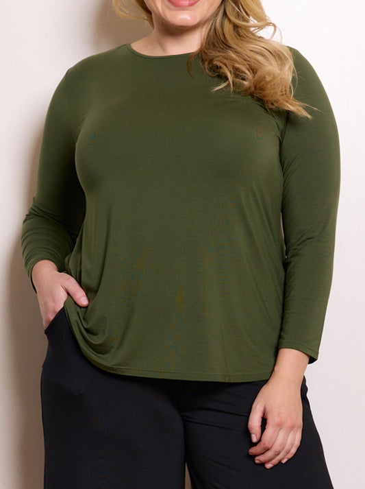 Image of a model wearing Tops. Product name - TANI CARA LONG SLEEVE TOP in Hunter Green colour by brand - Tani