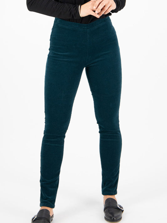 Image of a model wearing Pants. Product name - Vassalli Skinny Pull On Cord Pant in Forest colour by brand - Vassalli