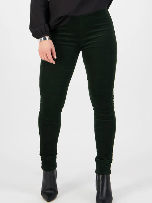 Image of a model wearing Pants. Product name - VASSALLI SKINNY PULL ON CORD PANT in Black colour by brand - Vassalli