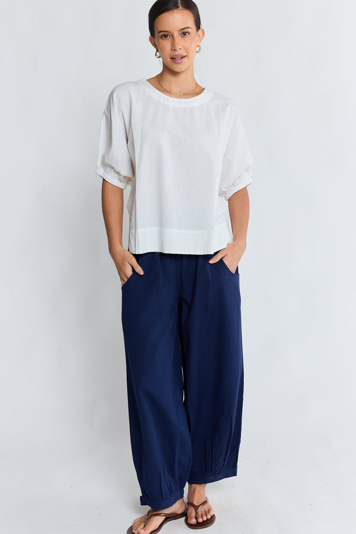 Image of a model wearing Pants. Product name - LulaLife Remi Balloon Pant Navy in Navy colour by brand - Lulalife
