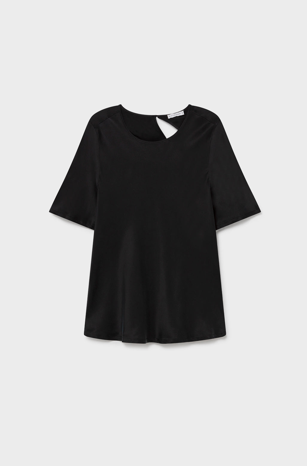 Image of a model wearing Tops. Product name - Short Sleeve Bias Top Black in Black colour by brand - Silk Laundry