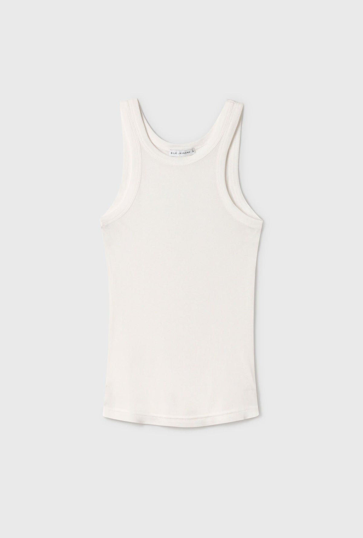 Image of a model wearing Tops. Product name - Jersey Tank White in White colour by brand - Silk Laundry