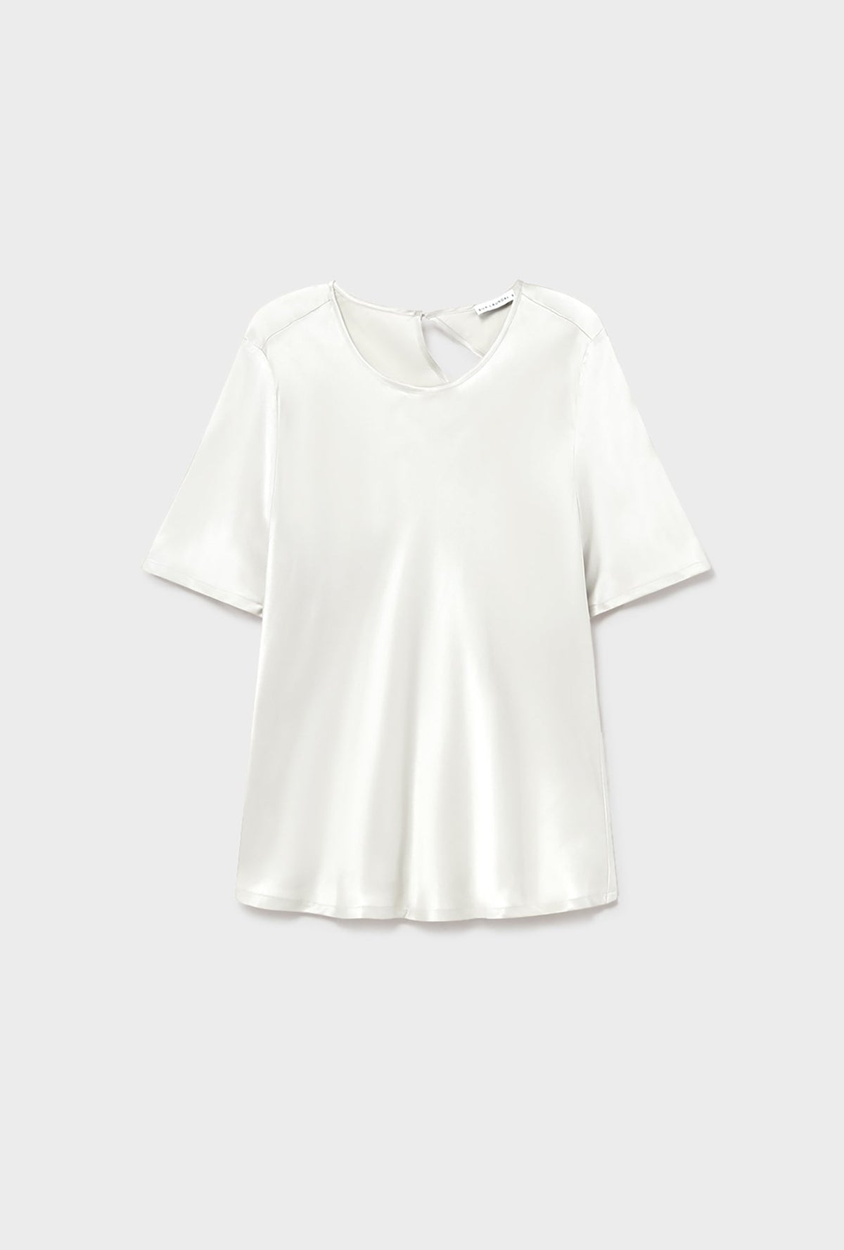 Image of a model wearing Tops. Product name - Short Sleeve Bias Top White in White colour by brand - Silk Laundry