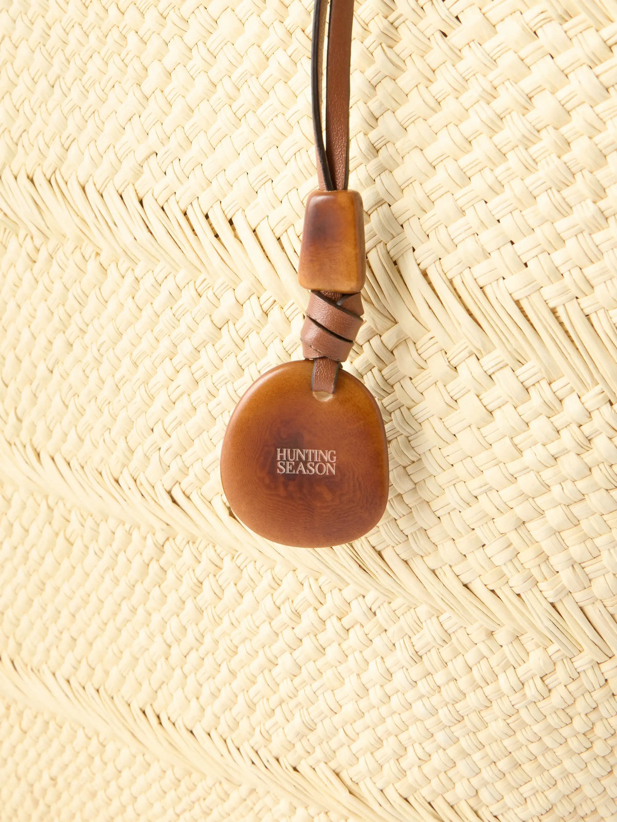 Trapeze Basket Leather-trimmed Woven Raffia Tote