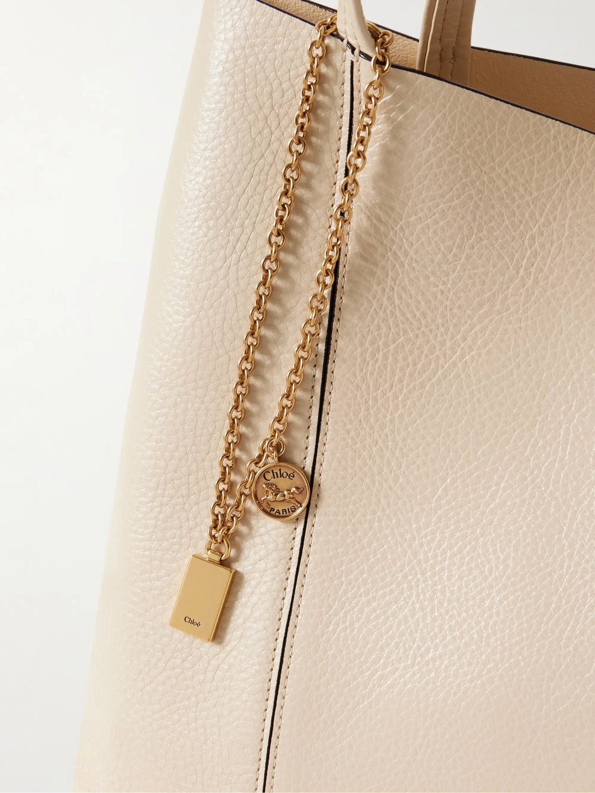 Spin Embellished Textured-leather Tote