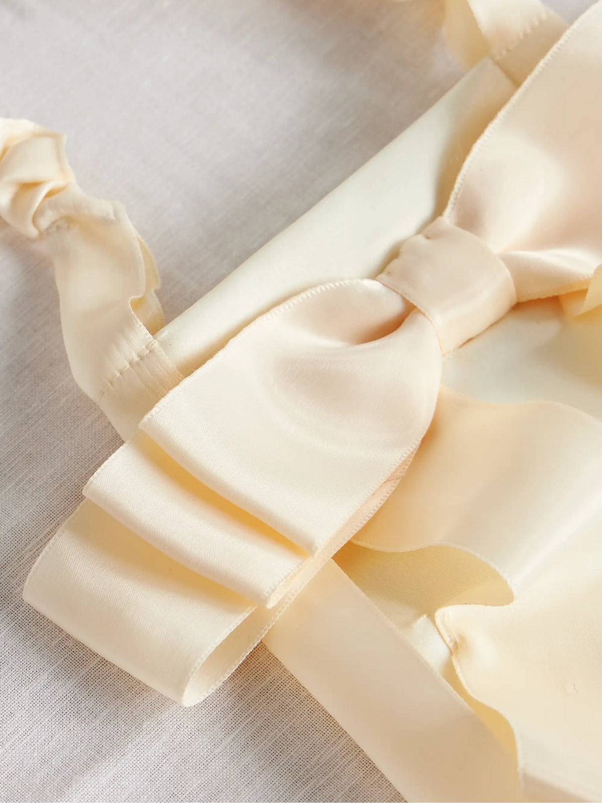Demi Bow-embellished Satin Baguette Pouch