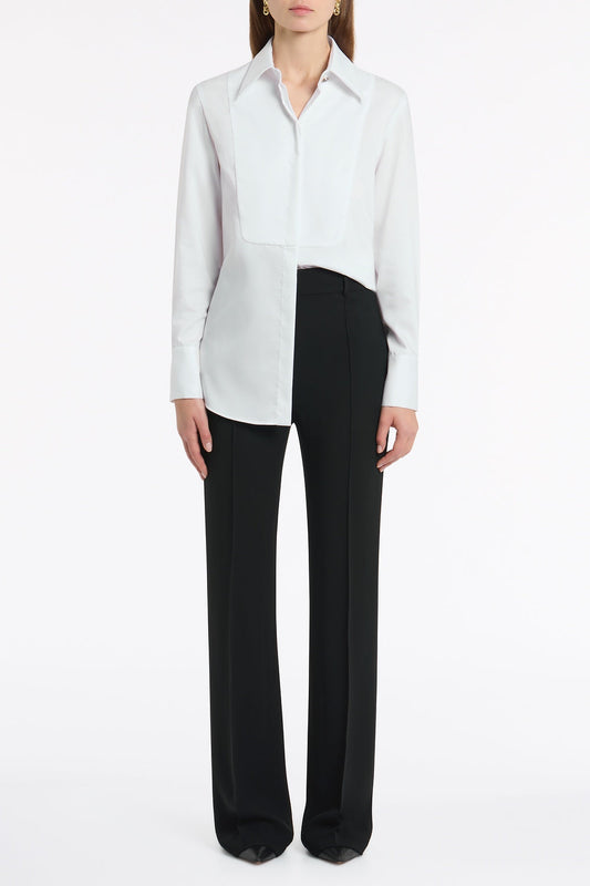 Image of a model wearing Tops. Product name - White Cotton Shirting Bib Front Shirt in White colour by brand - Carla Zampatti