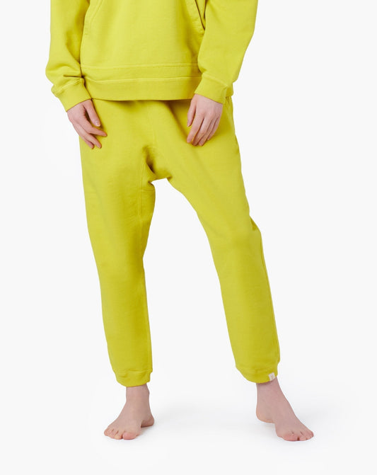Image of a model wearing Pants. Productname: Core Jogger Capri Lemon in Capri Lemon colour by brand - TKEES