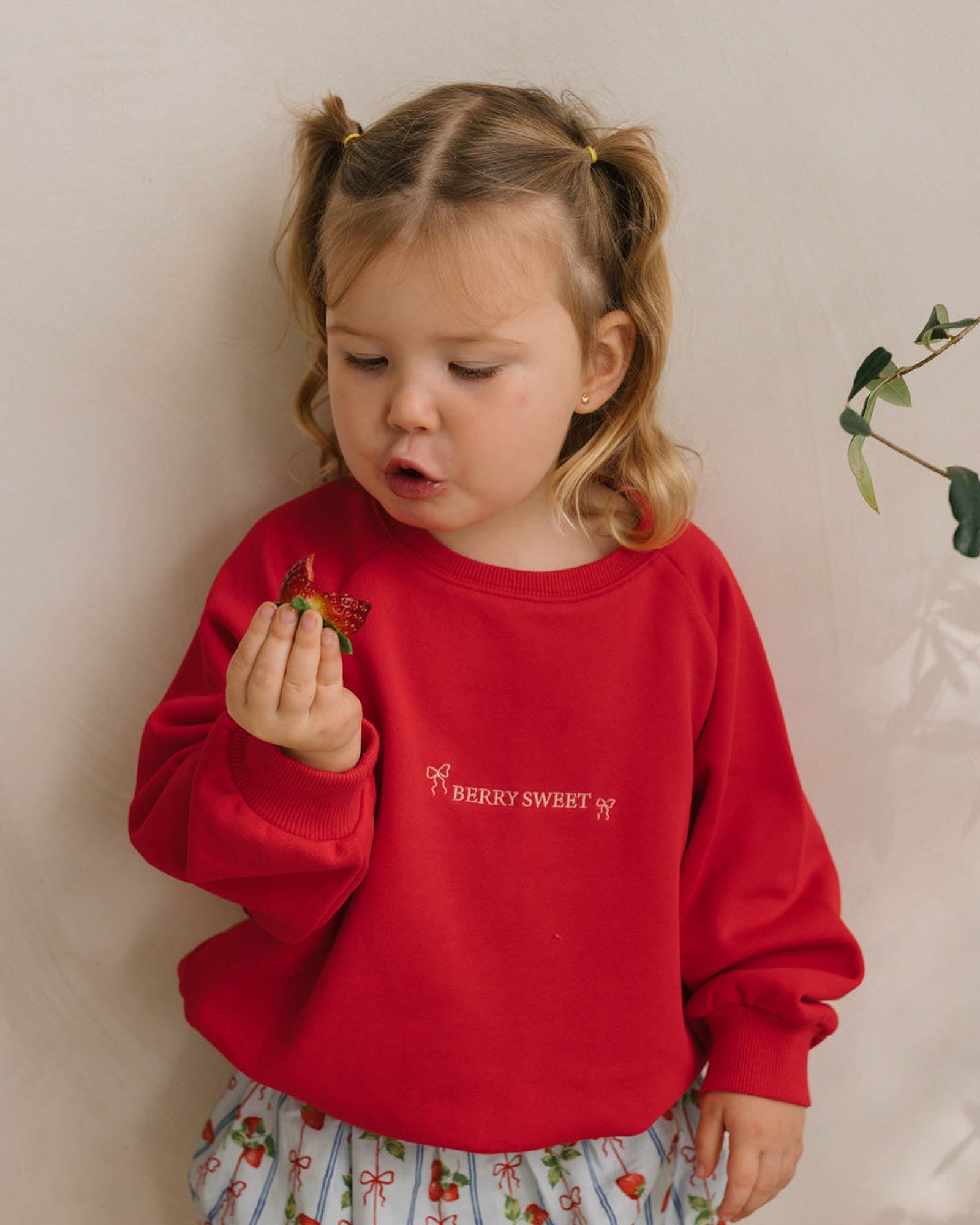Image of a model wearing Outerwear. Product name - River Sweatshirt in Berry Sweet colour by brand - Walnut Melbourne