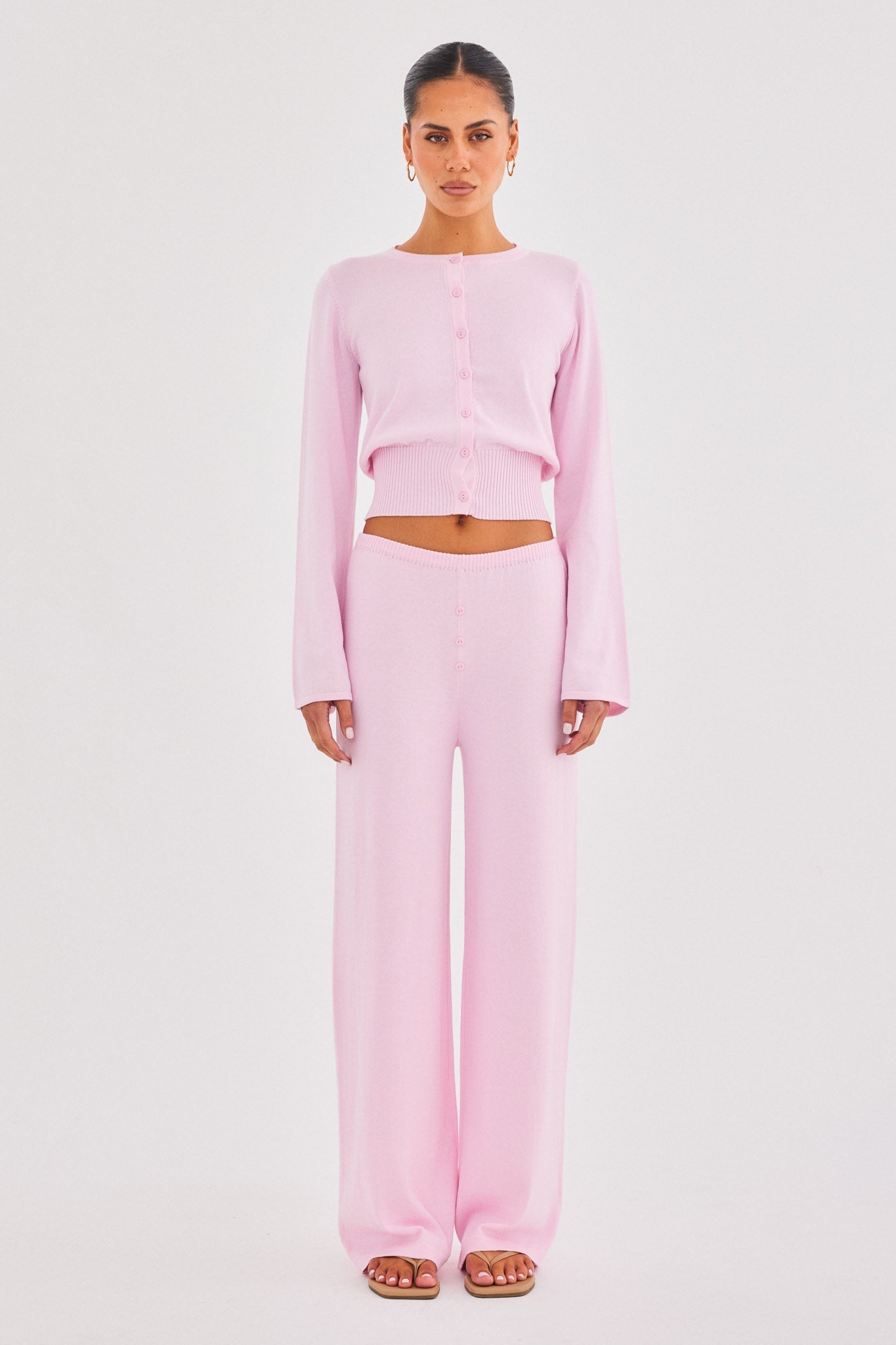 Image of a model wearing Pants. Productname: SNDYS AUGUST BUTTON PANTS in Pink colour by brand - SNDYS