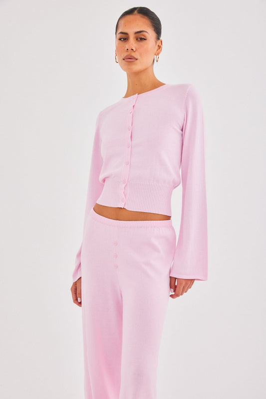 Image of a model wearing Outerwear. Productname: SNDYS AUGUST BUTTON UP TOP in Pink colour by brand - SNDYS