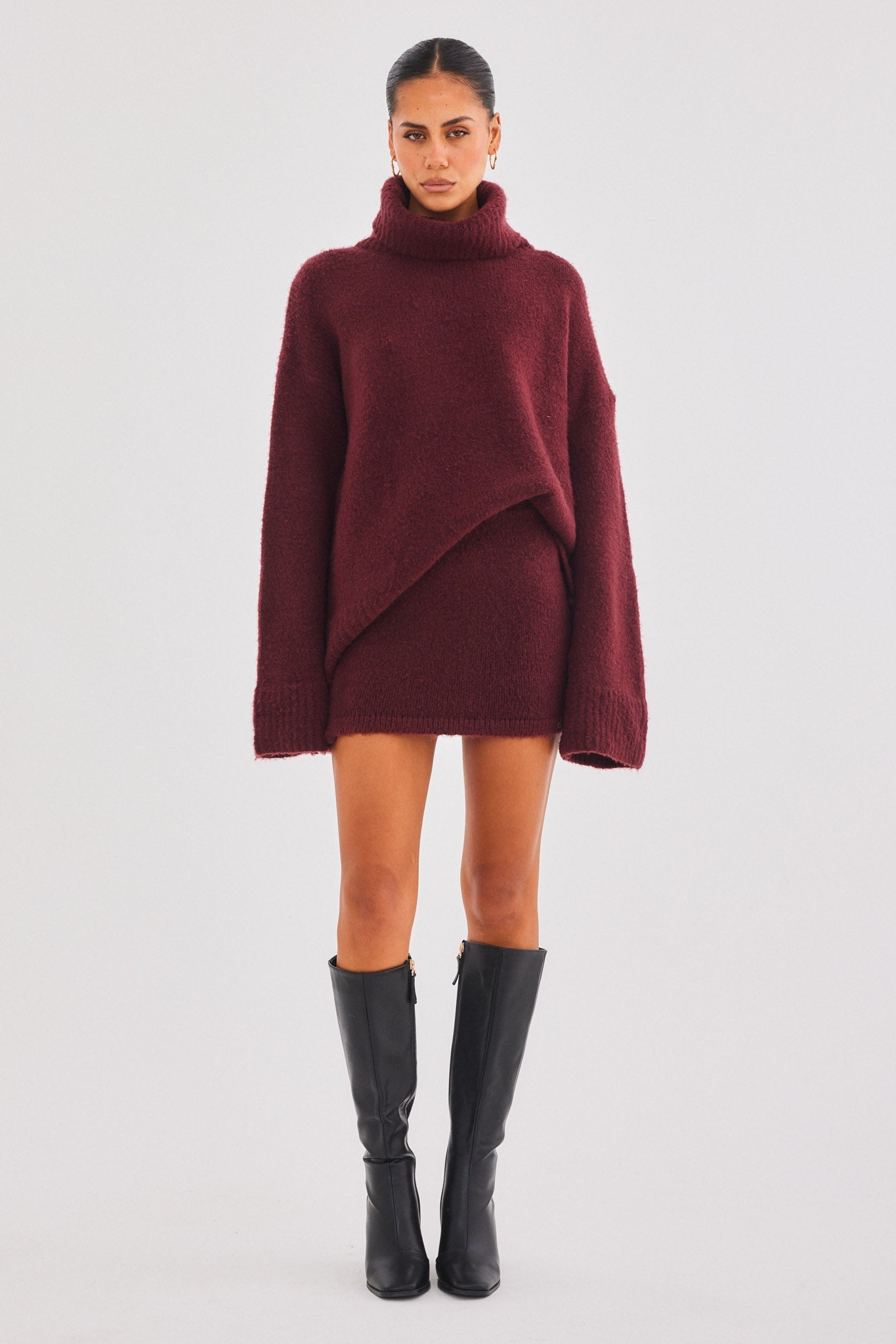 Image of a model wearing Skirts. Productname: SNDYS WINNIE MINI SKIRT in Cherry colour by brand - SNDYS