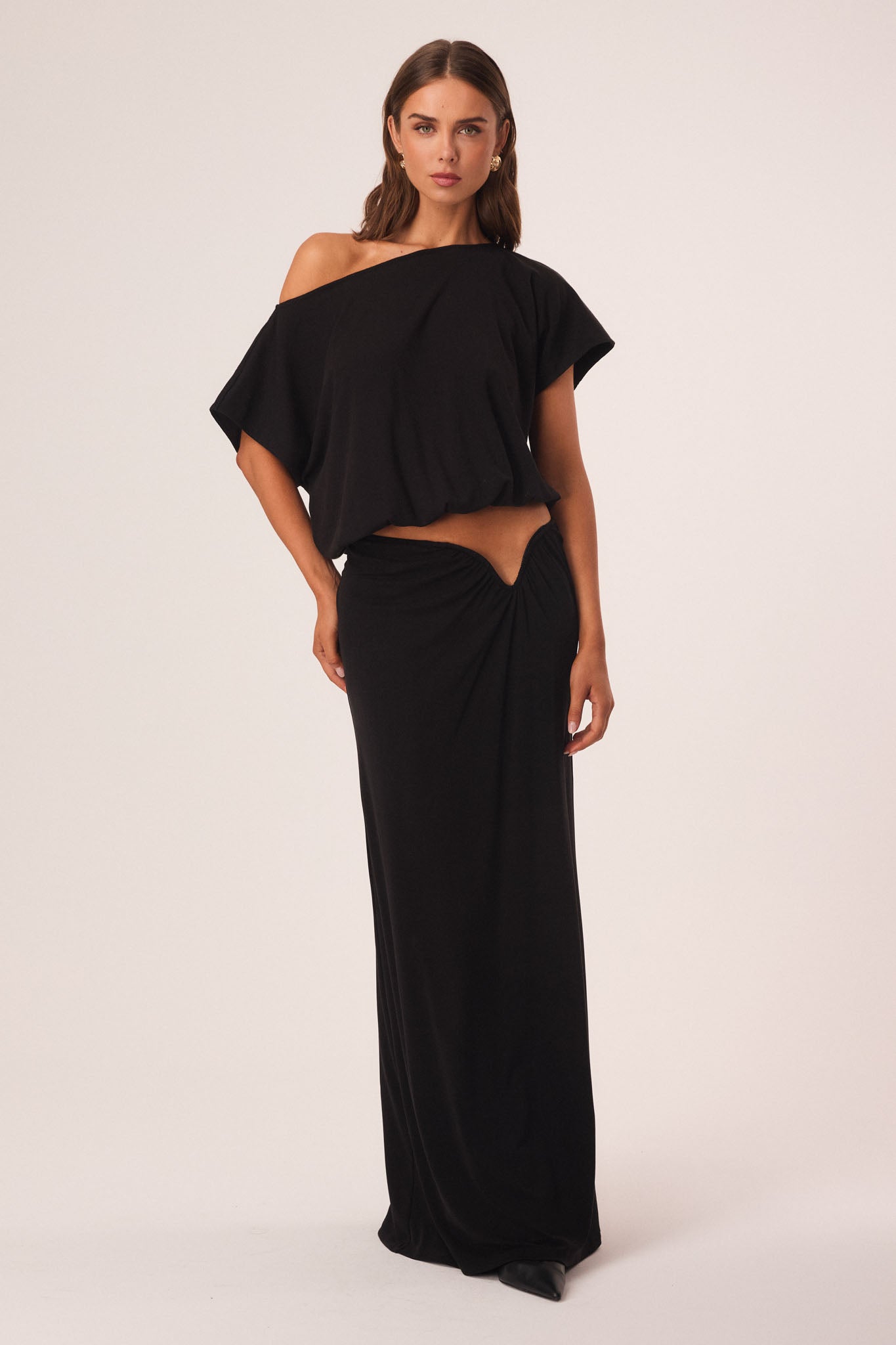 Image of a model wearing Skirts. Productname: SNDYS ALIA MAXI SKIRT in Black colour by brand - SNDYS